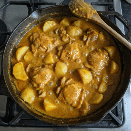 Add the potatoes and coconut milk