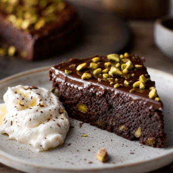 Rich Chocolate & Pistachio Cake with Boozy Whipped Crème Fraîche